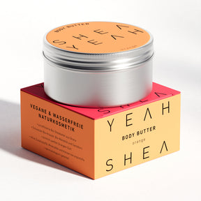Shea Yeah Body Butter mit Orangenduft, Dose auf der Schachtel, Naturkosmetik mit Sheabutter.